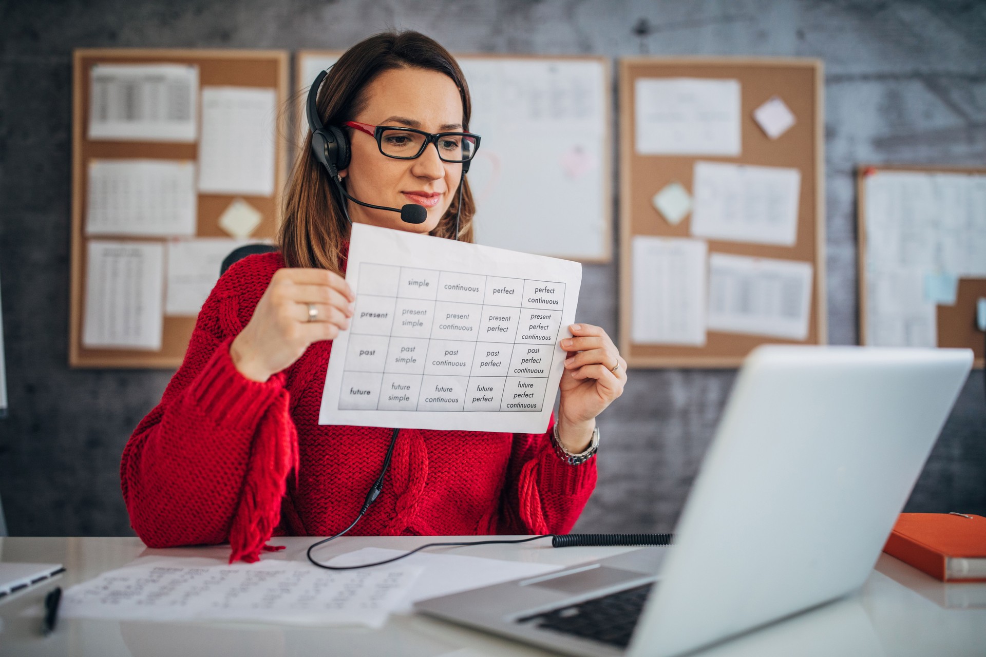 Young female teacher holding online class